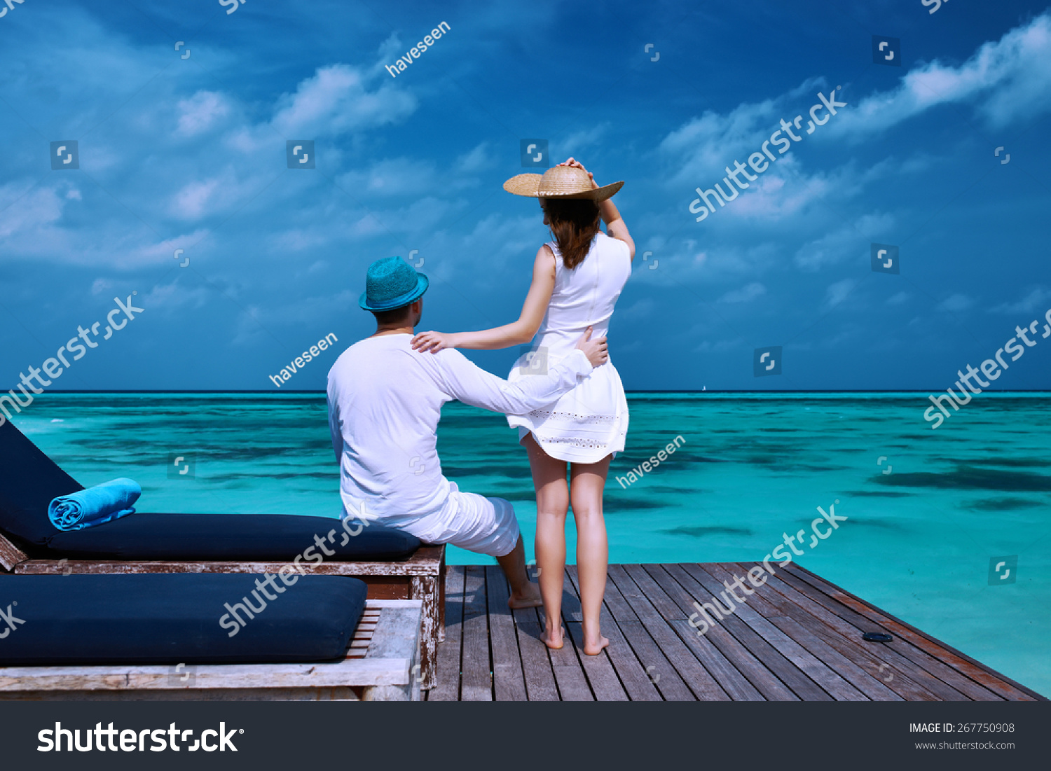 Couple on a tropical beach jetty at Maldives #267750908