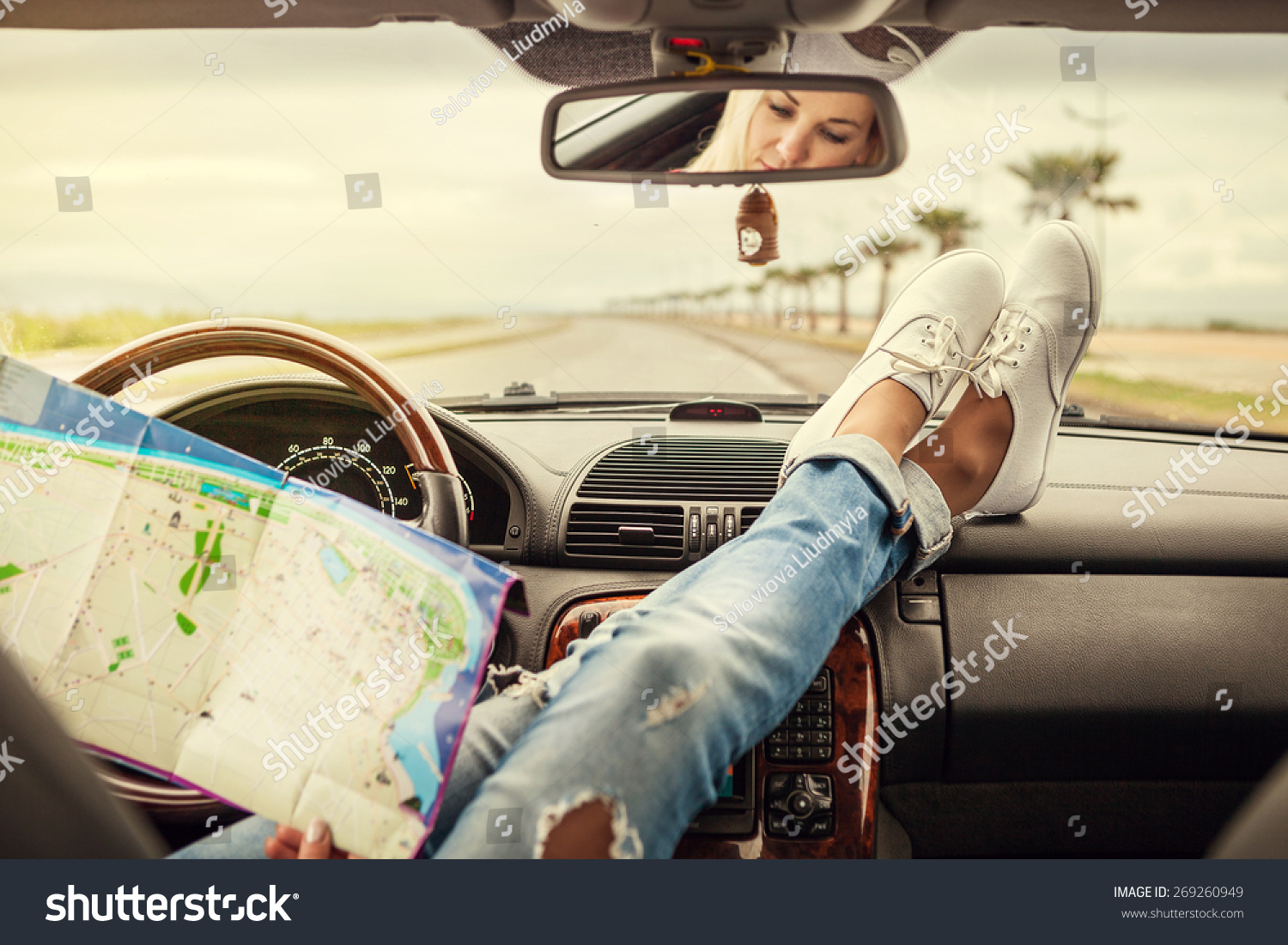 Young woman alone car traveler with map  #269260949