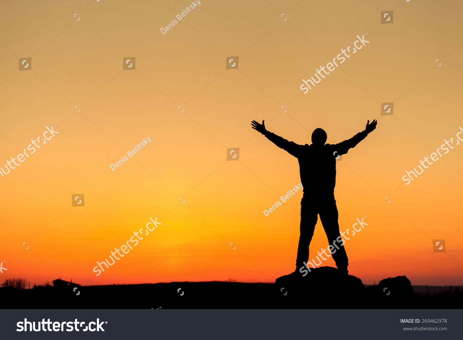 Silhouette of man with arms raised up and beautiful sky. Element of design. Summer sunset. Background #269462978