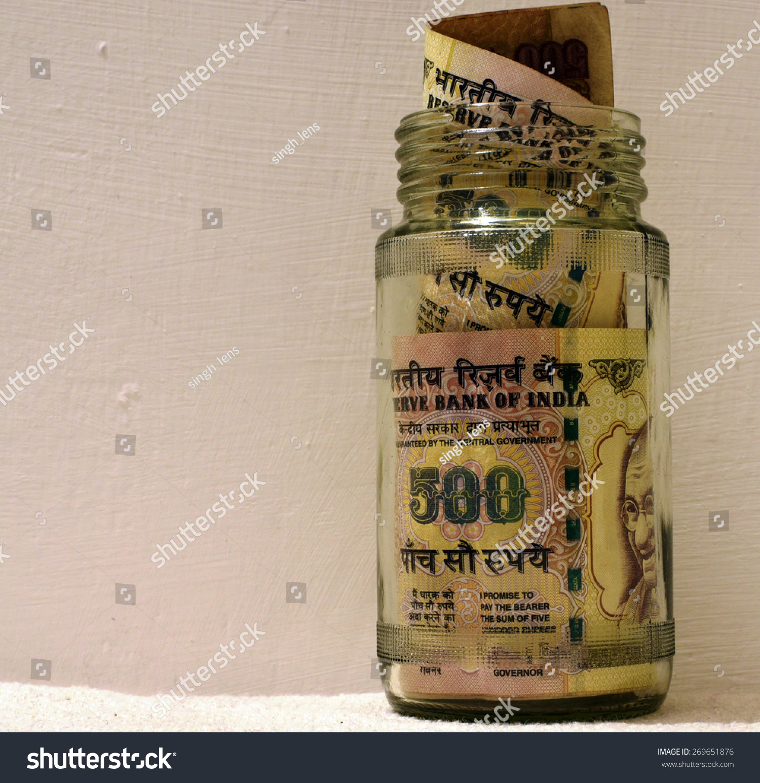 Indian money in glass jar with lot of space for text #269651876