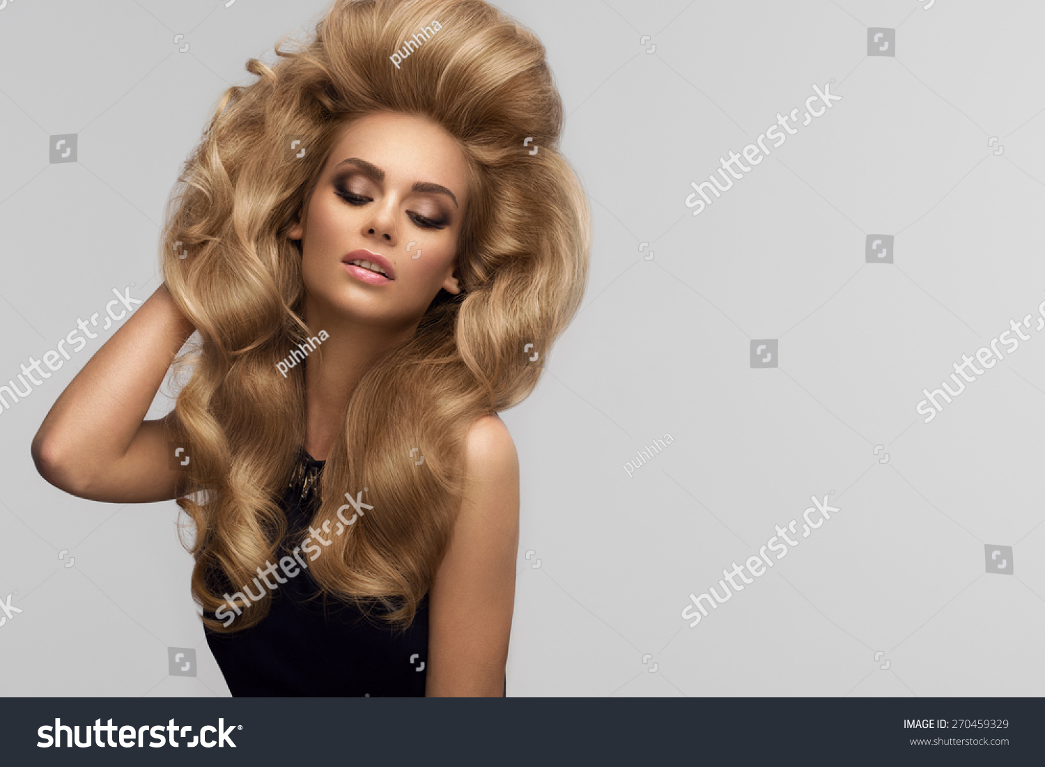 Hair volume. Portrait of beautiful Blonde with Long Wavy Hair. High quality image. #270459329
