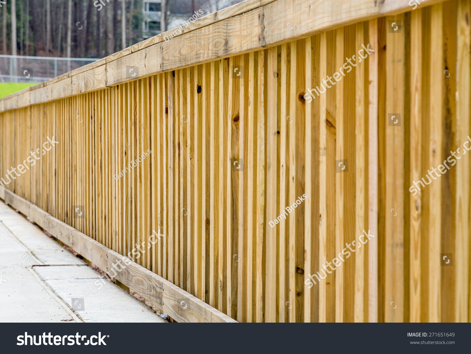 New treated pine lumber railings on the side of a bridge #271651649