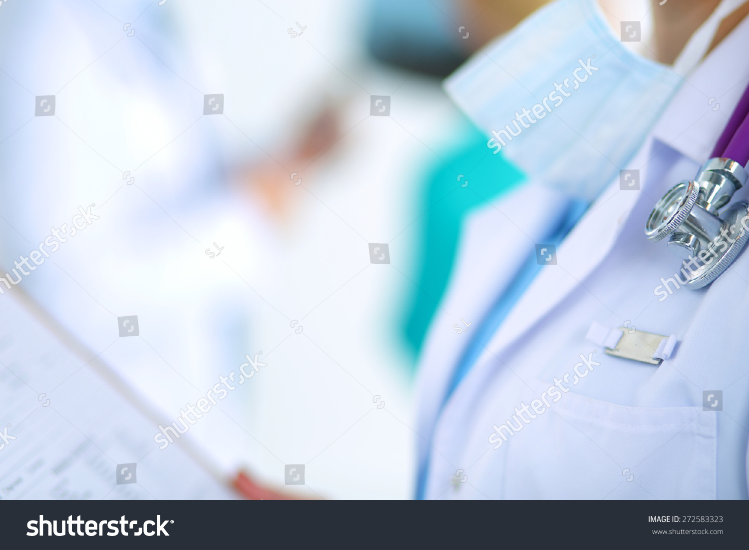 Woman doctor standing with folder at hospital  #272583323