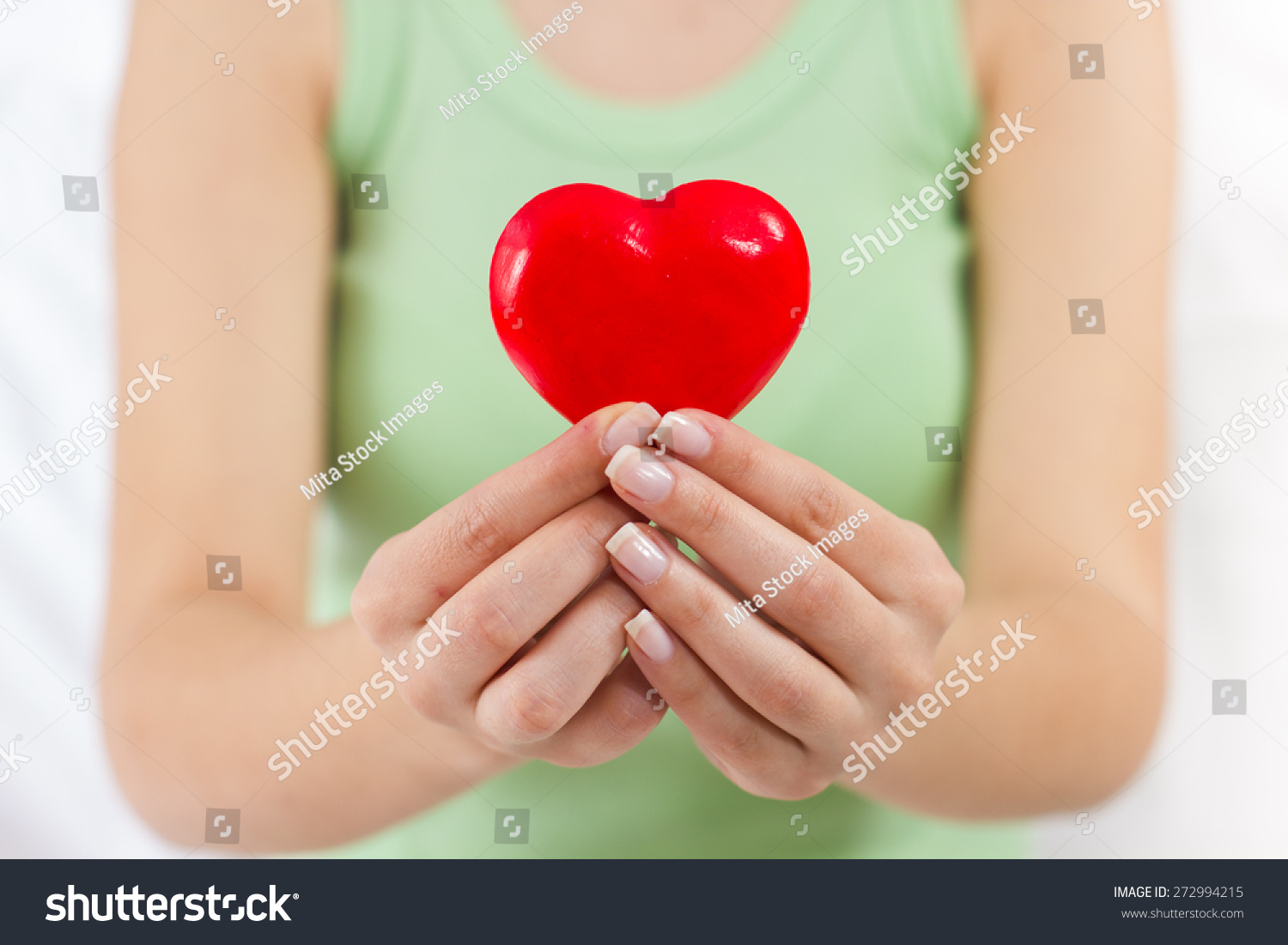 Health Care Love Support Red Heart in female hands. #272994215