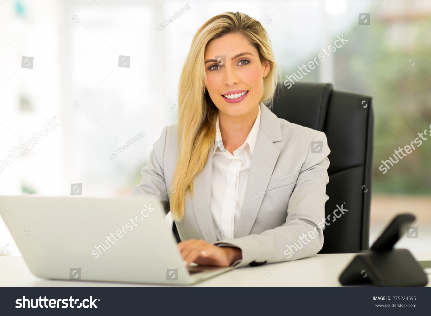 beautiful young businesswoman using computer #275224595