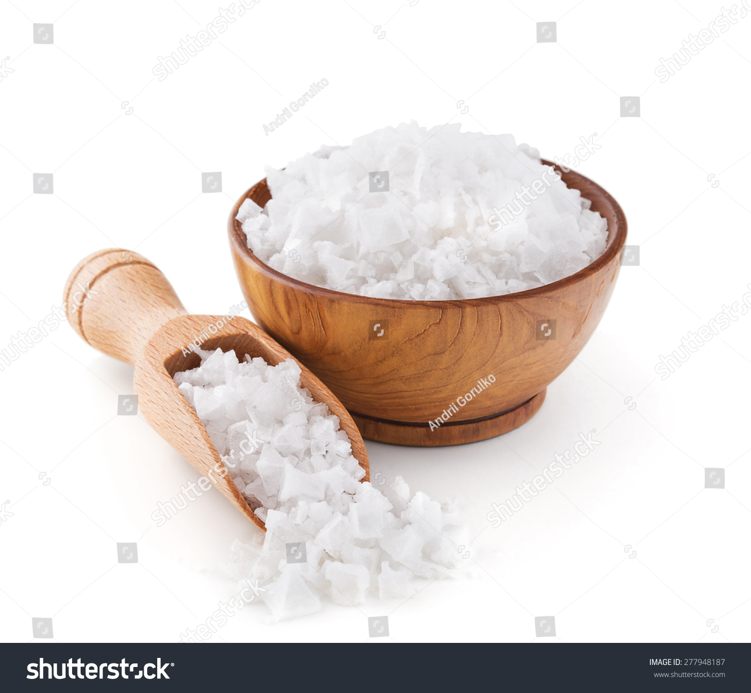 Cyprus sea salt flakes in a wooden bowl isolated on white background #277948187