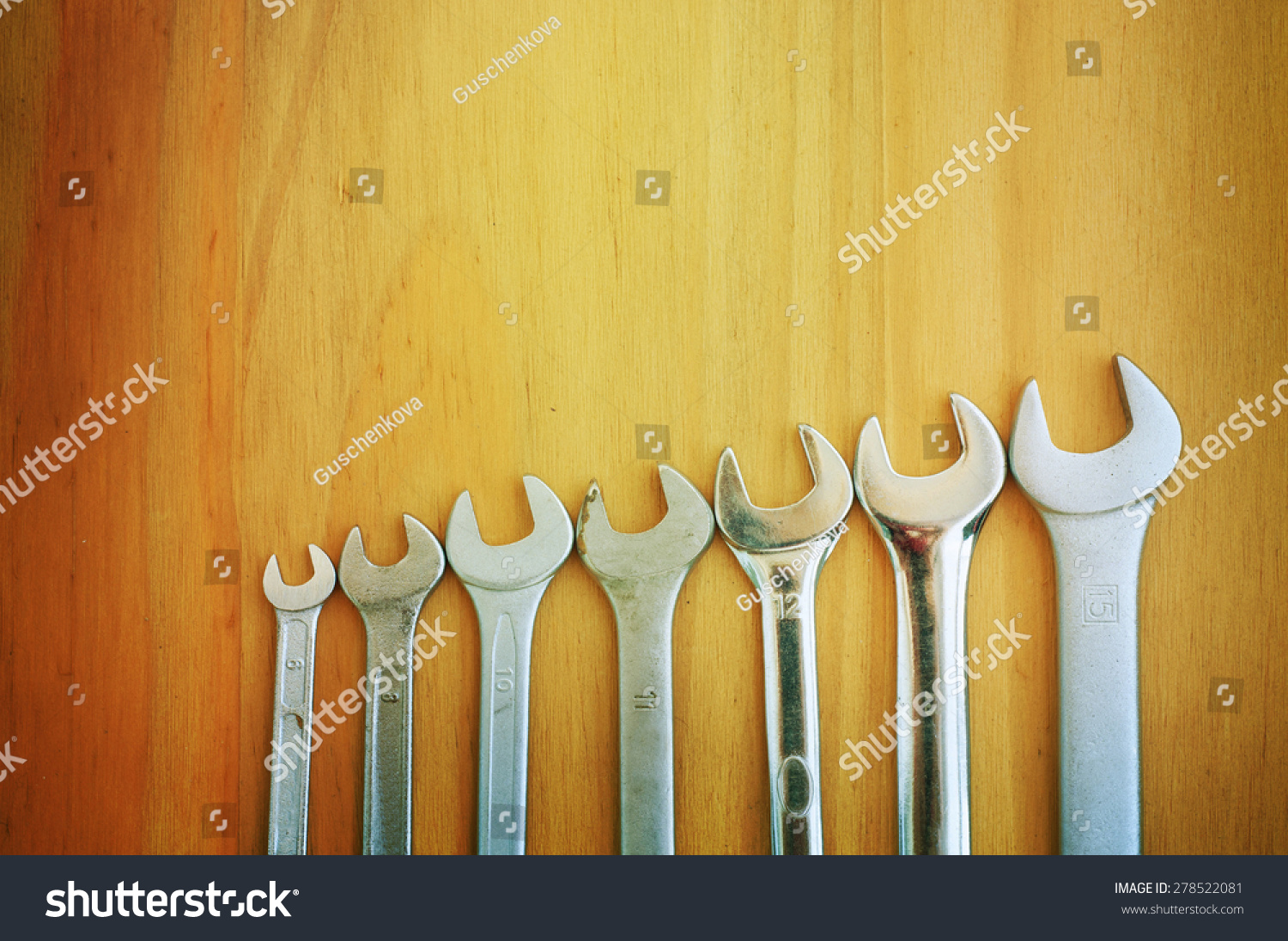 Set of tools over a wood panel with space for text #278522081