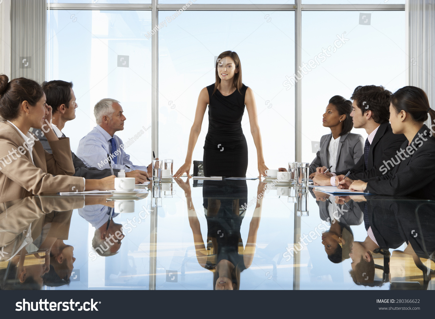Group Of Business People Having Board Meeting Around Glass Table #280366622