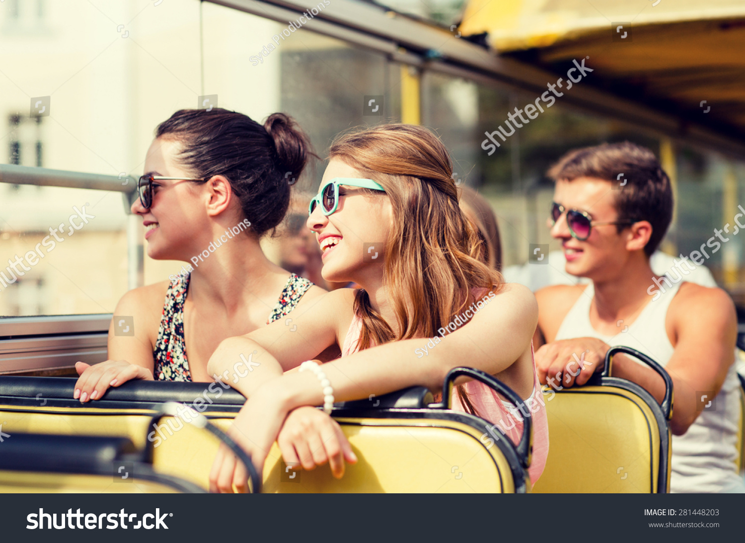 friendship, travel, vacation, summer and people concept - group of smiling friends traveling by tour bus #281448203