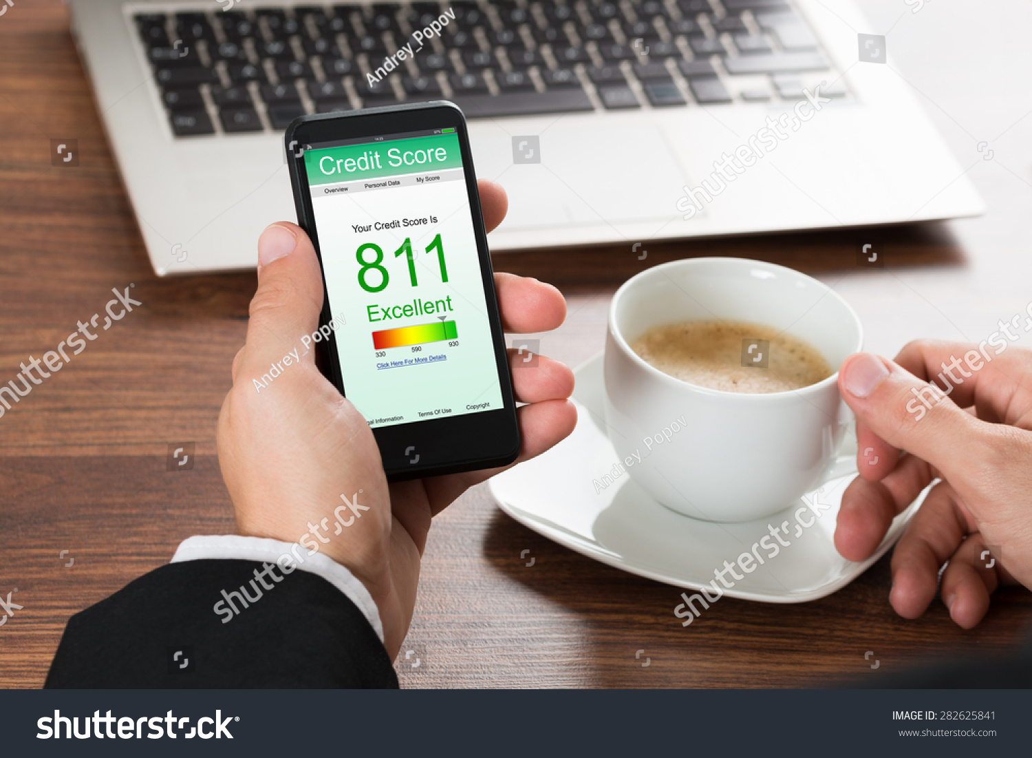 Close-up Of A Businessman Checking Credit Score Online On Cellphone While Having Coffee #282625841