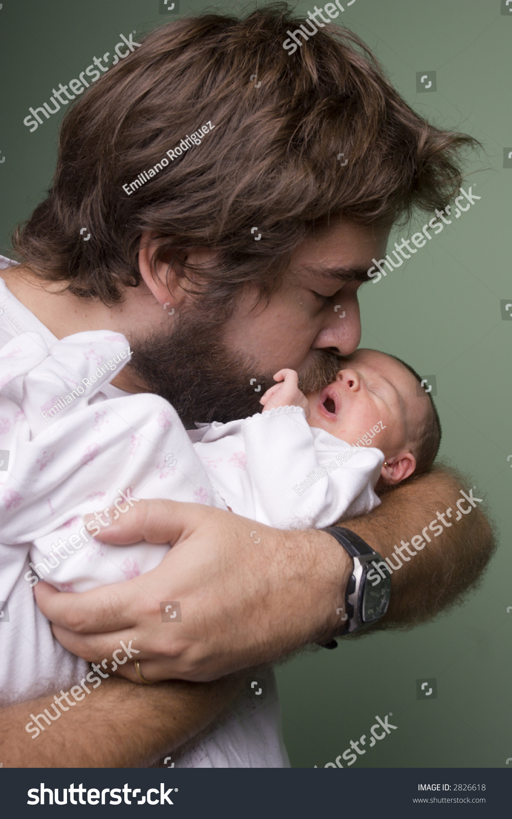 Young father kissing his newborn baby #2826618