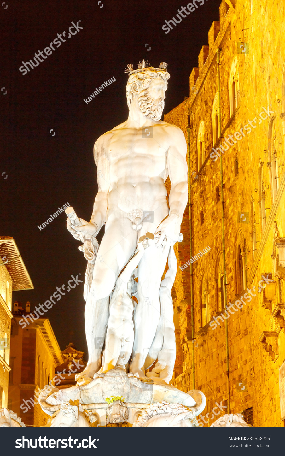 Neptune sculpture installed in the fountain in Piazza della Signoria in Florence at night #285358259