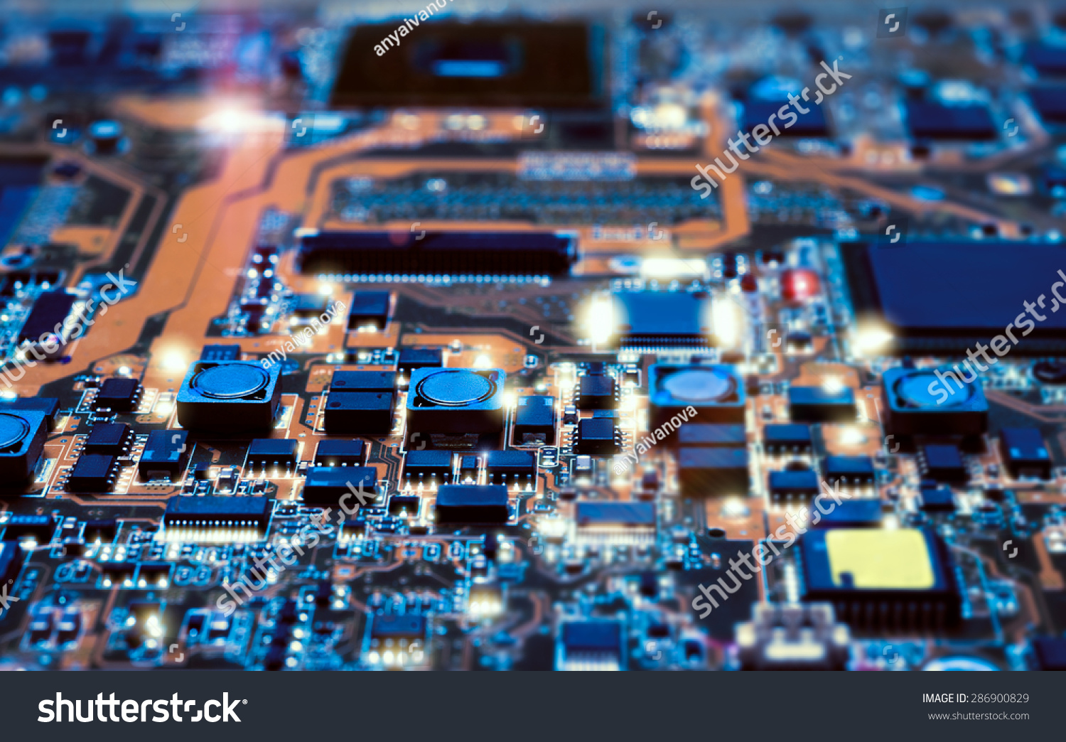 Closeup on electronic board in hardware repair shop, blurred and toned image. Shallow DOF, focus on the middle left field #286900829