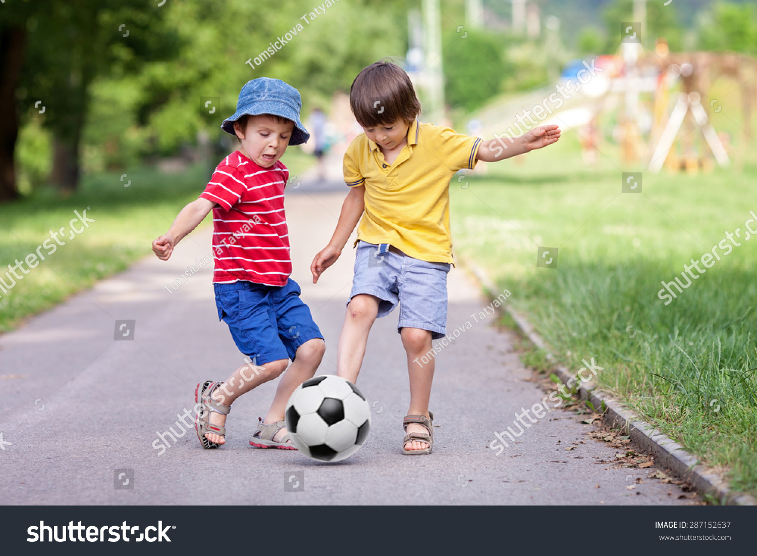 two cute little kids playing football together summertime children playing soccer outdoor - Little Kids Pictures two cute little kids playing football together summertime children playing soccer outdoor - Little Kids Pictures