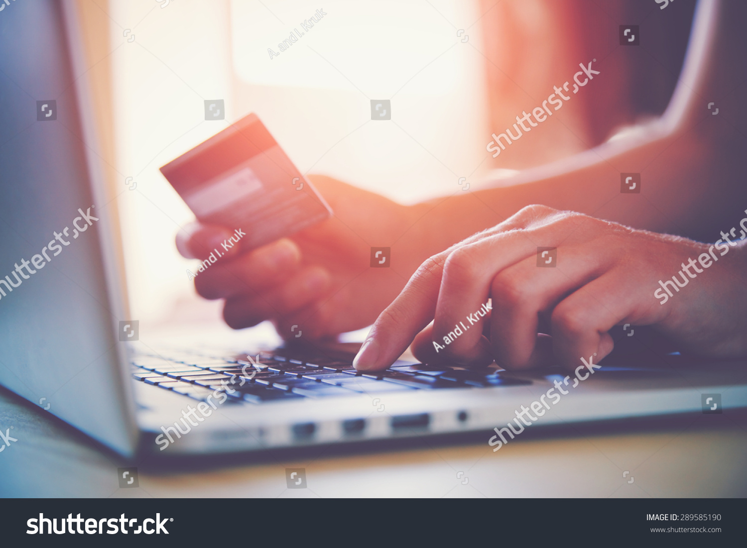 Hands holding credit card and using laptop. Online shopping #289585190
