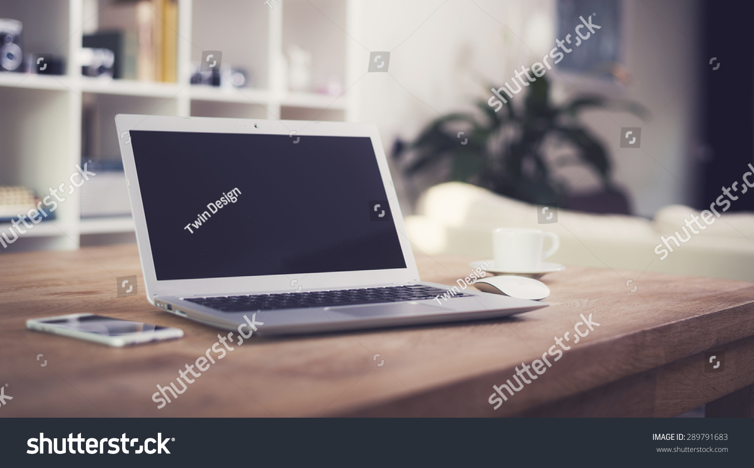 Laptop on table, home interior. #289791683