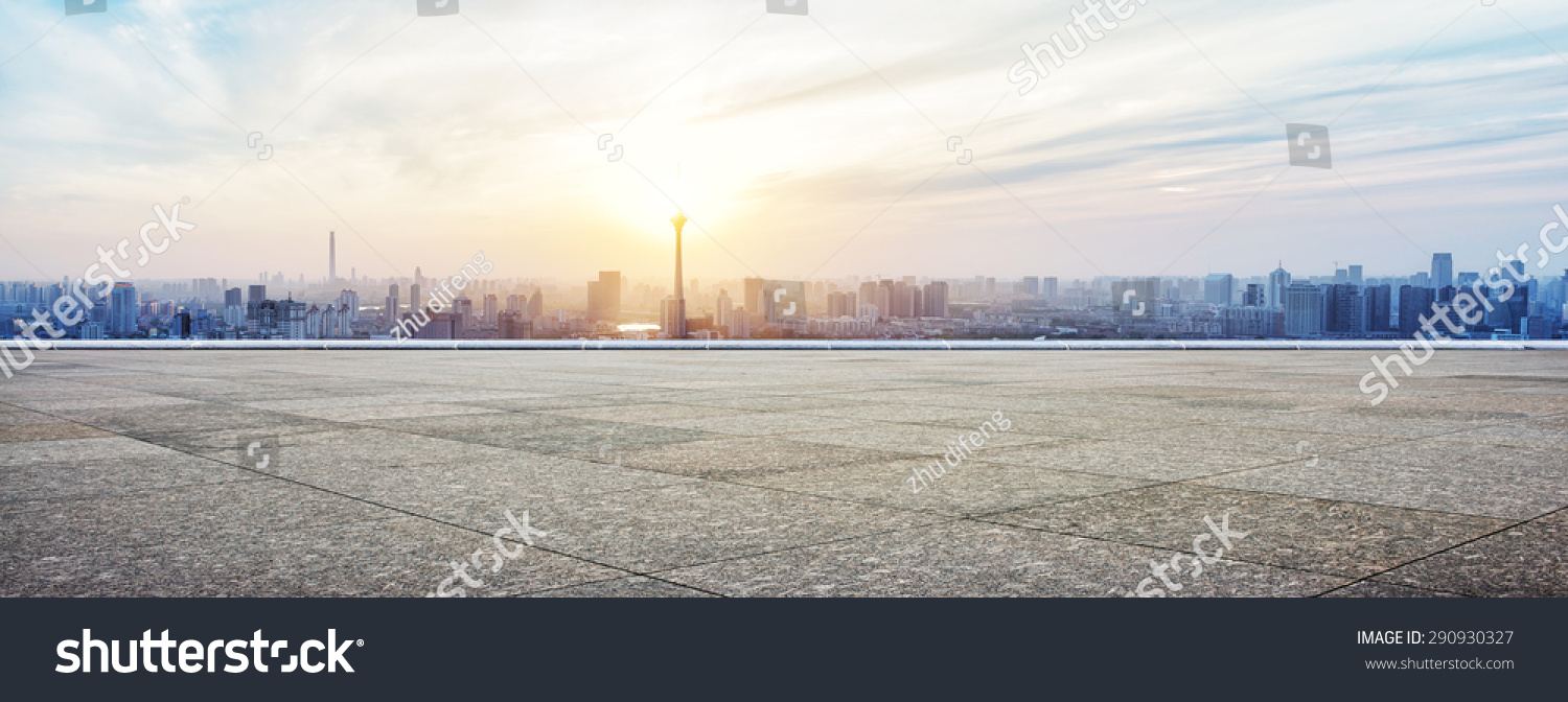 Panoramic skyline and buildings with empty concrete square floor #290930327