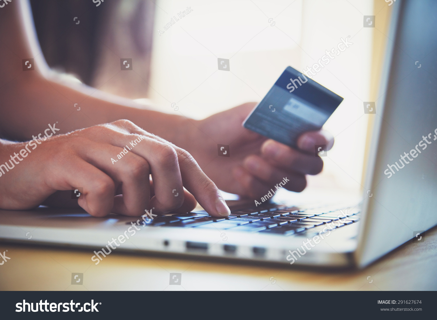 Hands holding credit card and using laptop. Online shopping #291627674