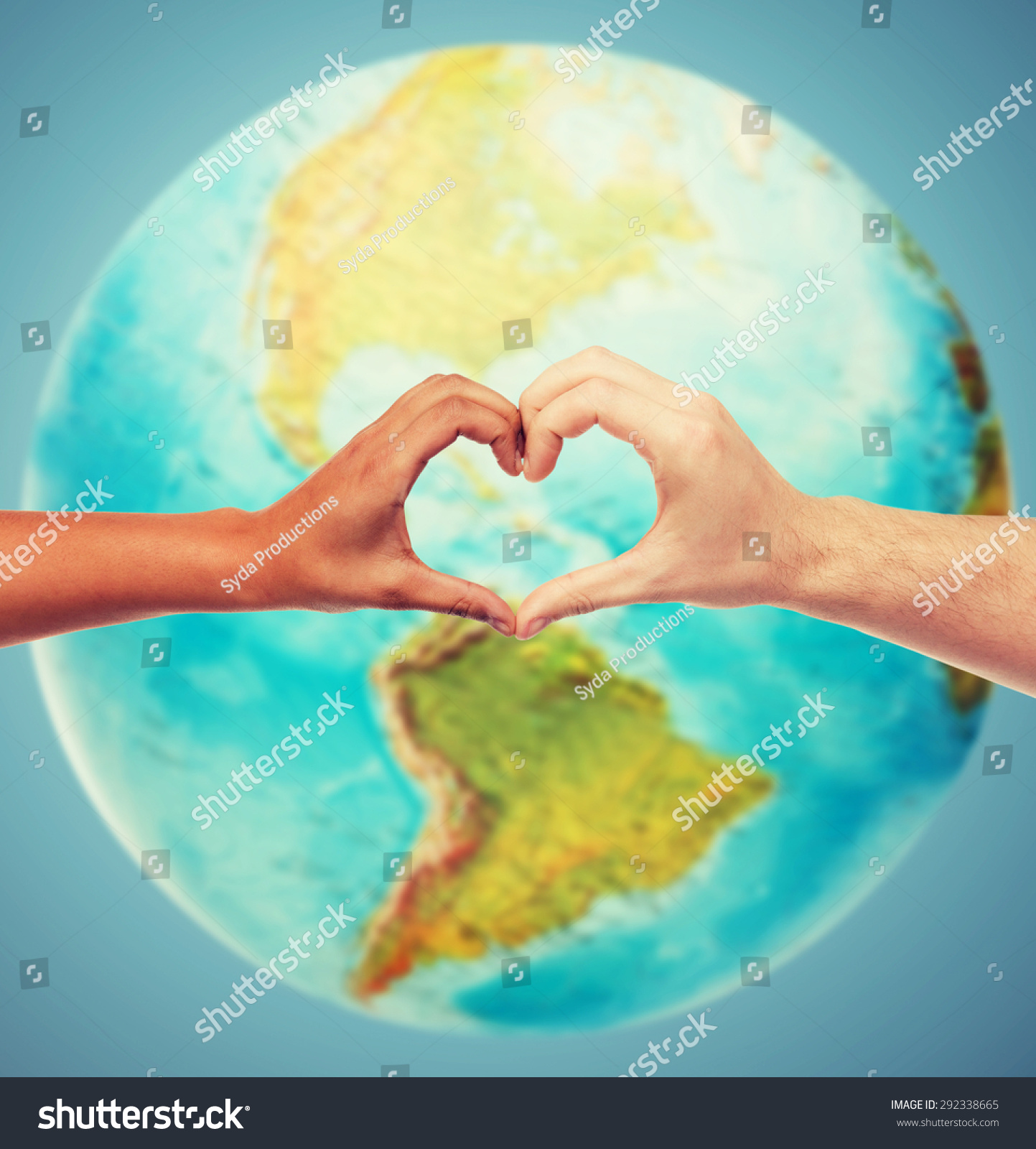 people, peace, love, life and environmental concept - close up of human hands showing heart shape gesture over earth globe and blue background #292338665