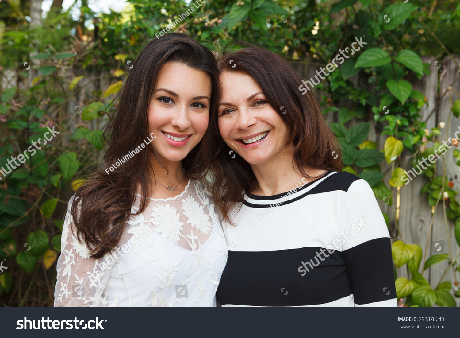 Mother and daughter portrait in a outdoor setting. #293878640