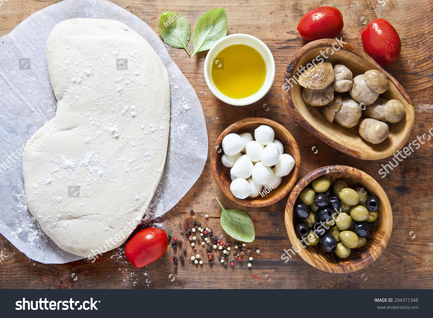 pizza dough and components for preparation homemade  hot rural health pizza. Food ingredients on the wooden background. small mozzarella, mushrooms, green and black olives #294371348