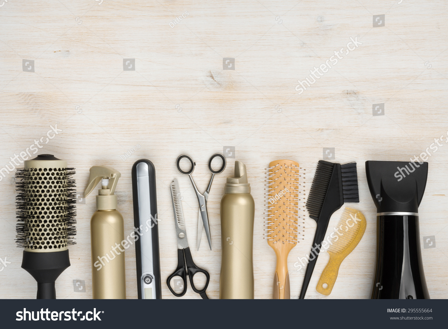 Hairdressing tools on wooden background with copy space at top #295555664
