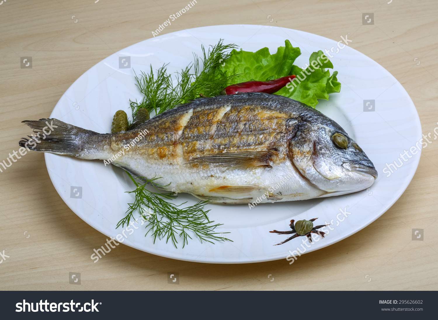 Grilled dorado with salad leaves and dill #295626602