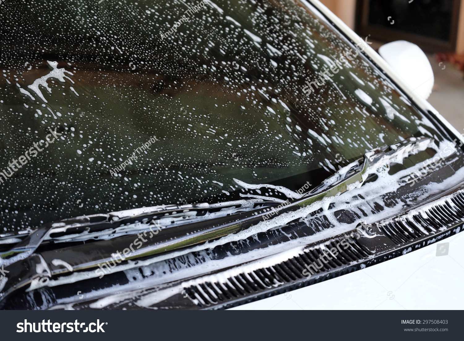 foam on wind shield while car washing #297508403