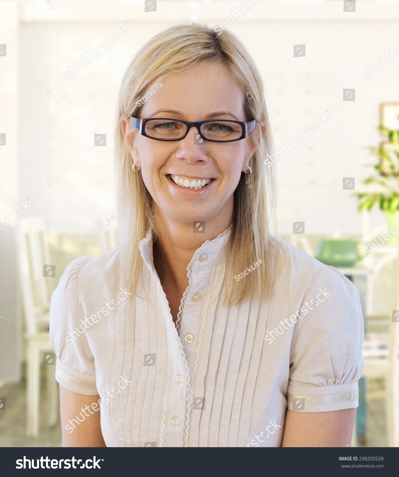 Portrait of middle-aged woman smiling happy, looking at camera. #298205528
