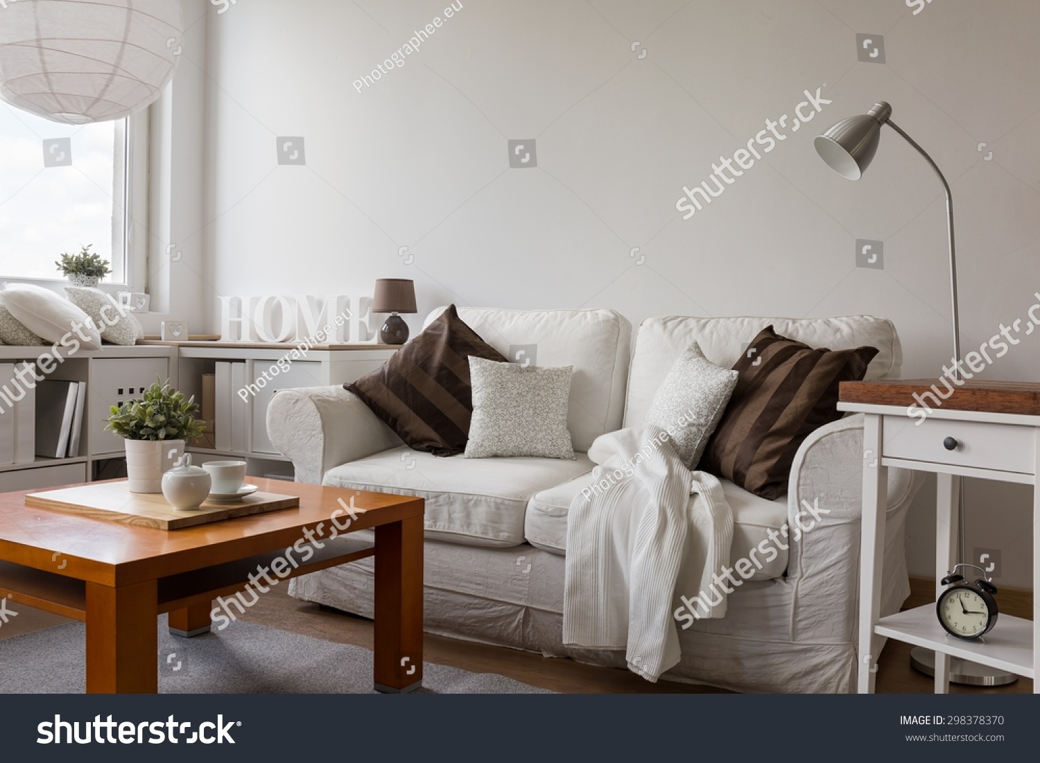 Small cozy living room in white flat #298378370