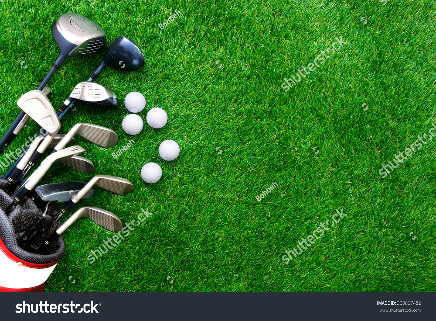 Golf ball and golf club in bag on green grass #300867482