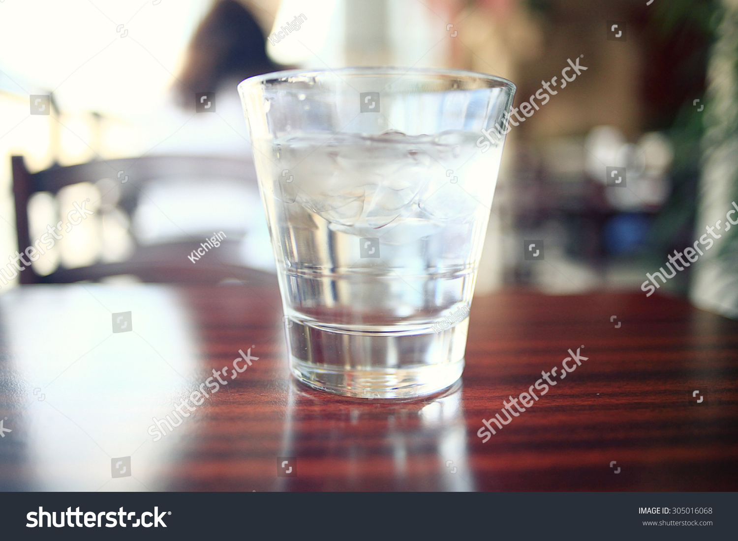 glass of water on a table in a restaurant #305016068