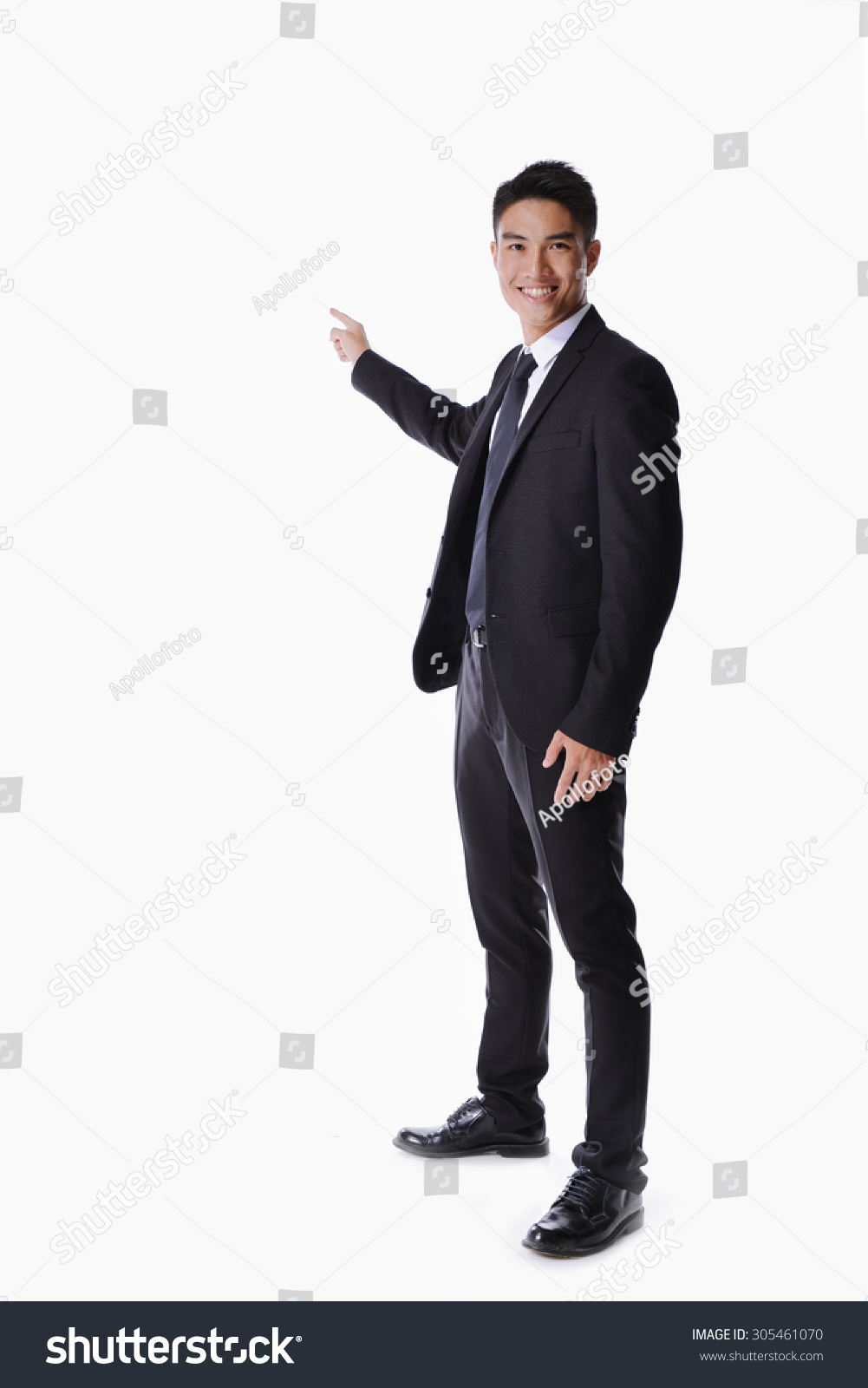 full body picture of a happy business man presenting something on a white background #305461070
