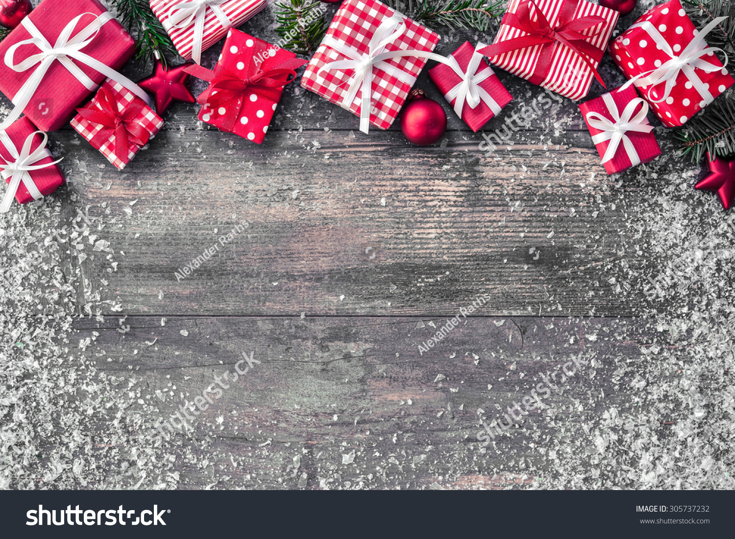 Christmas background with decorations and gift boxes on wooden board #305737232
