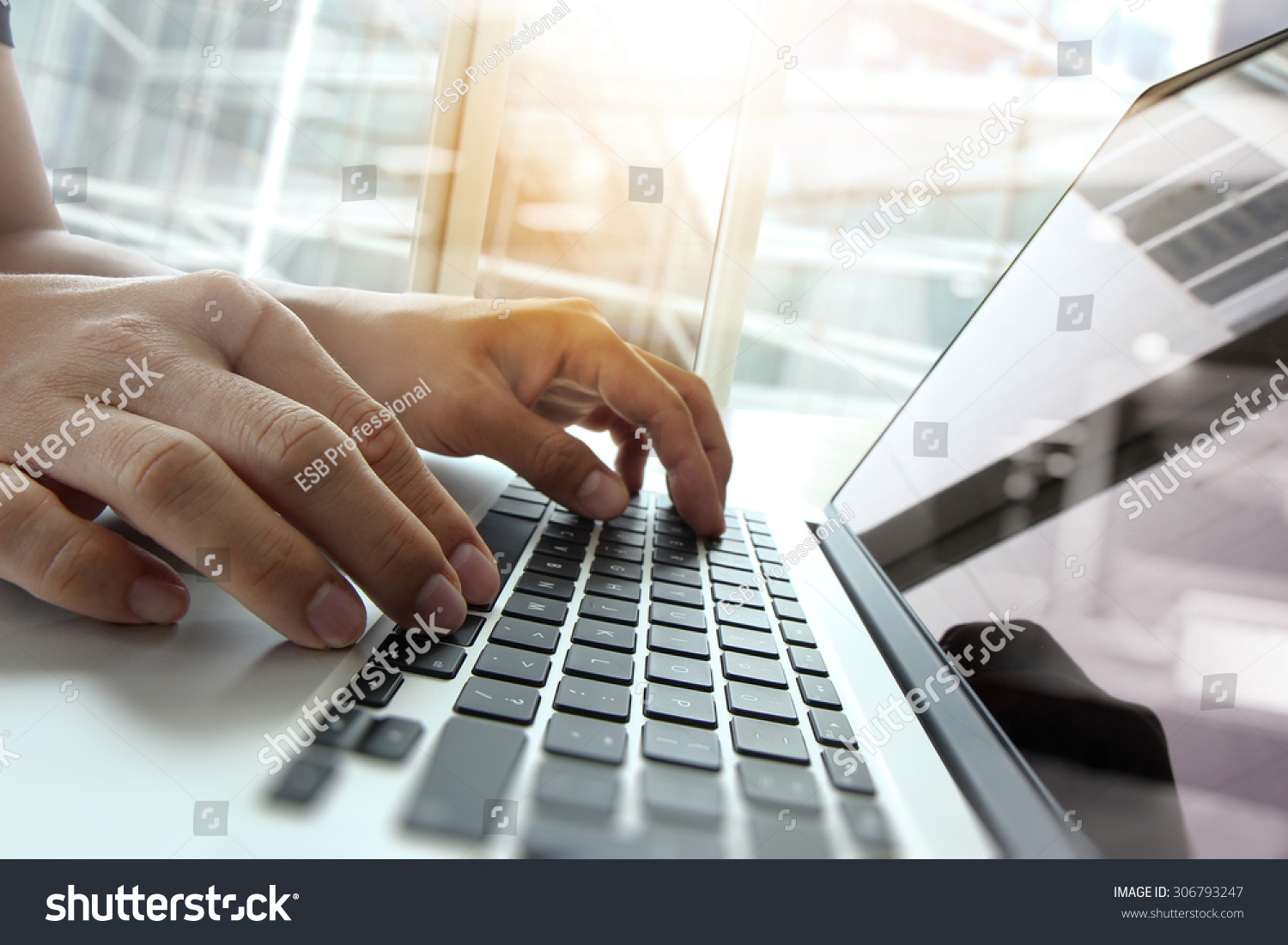 Double exposure of business man hand working on blank screen laptop computer on wooden desk as concept #306793247
