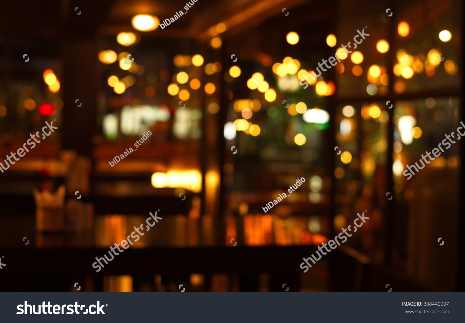 table in blur pub or bar nightclub and restaurant at Christmas night celebrate party with bokeh light background #308440007