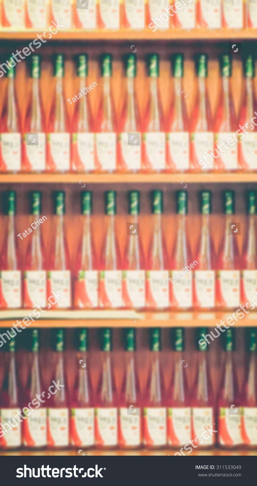De focused/Blurred image of rows of glass bottled juice. #311533049