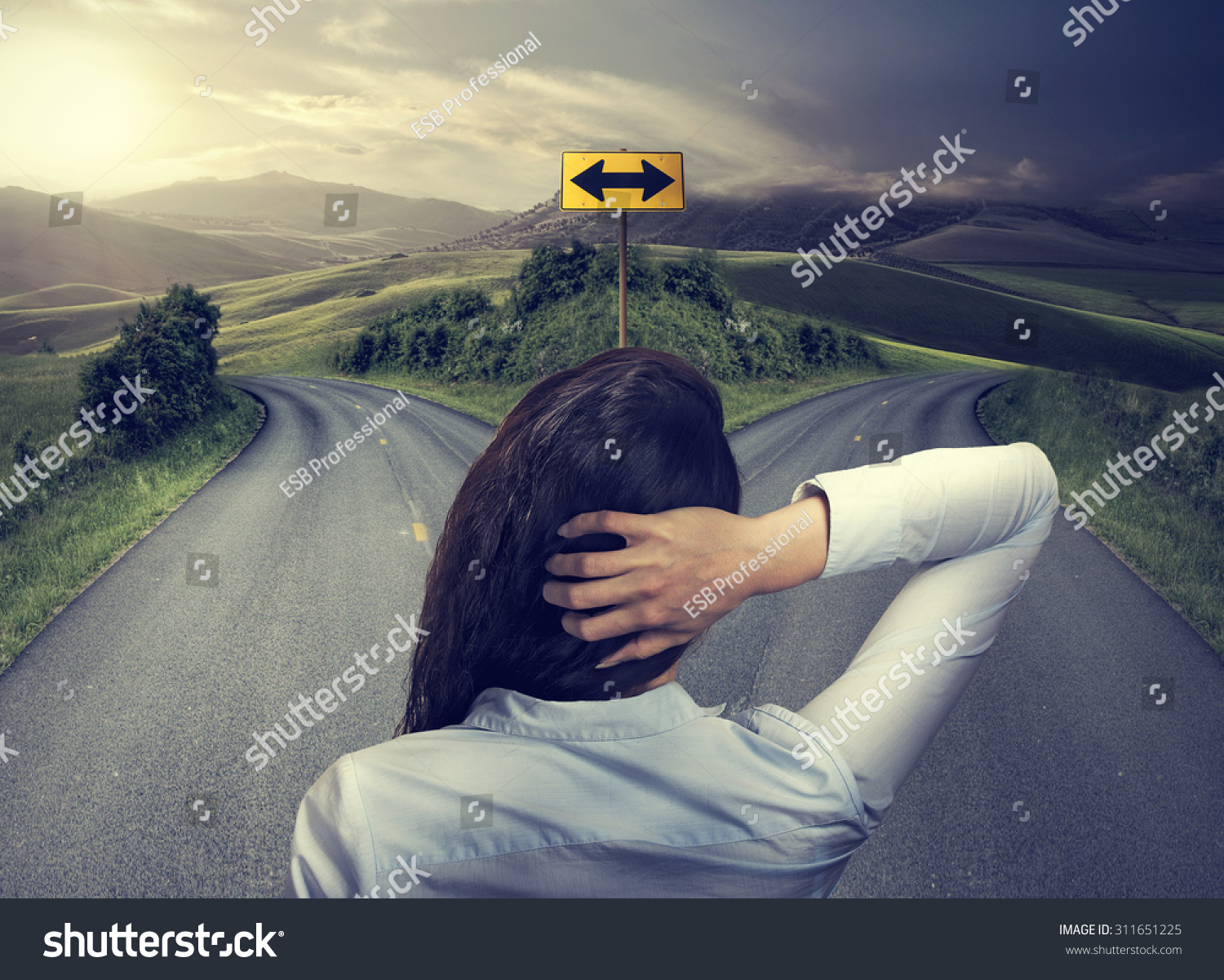 business woman in front of two roads thinking deciding hoping for best taking chance #311651225