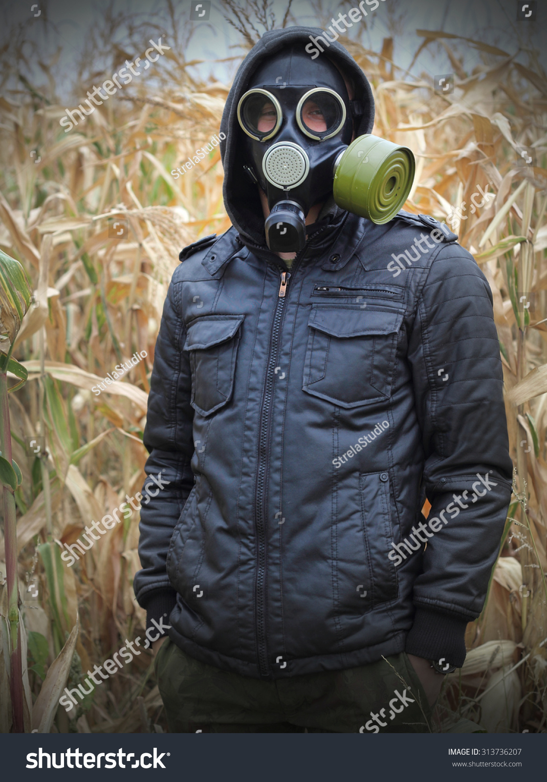man gas mask gun concept the danger of war #313736207