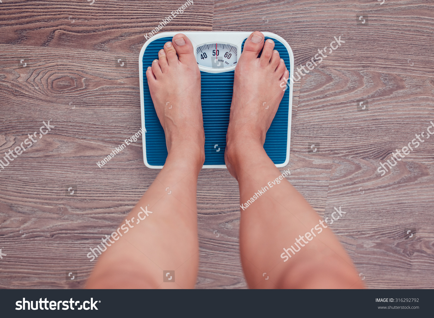 Girl is measuring her weight on the scales. #316292792