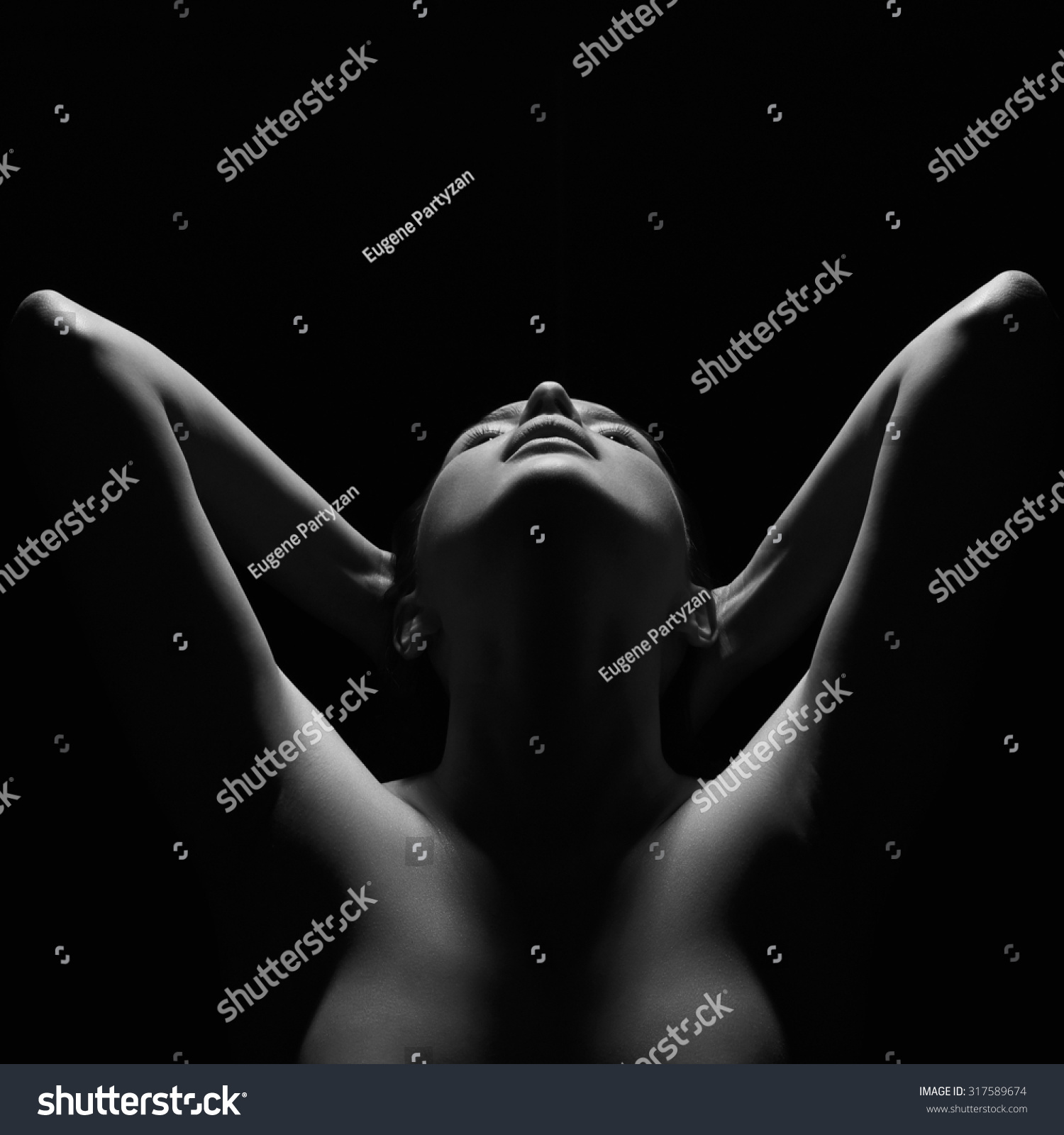 dark female silhouette, hands and face. art portrait.unusual photo of body woman #317589674