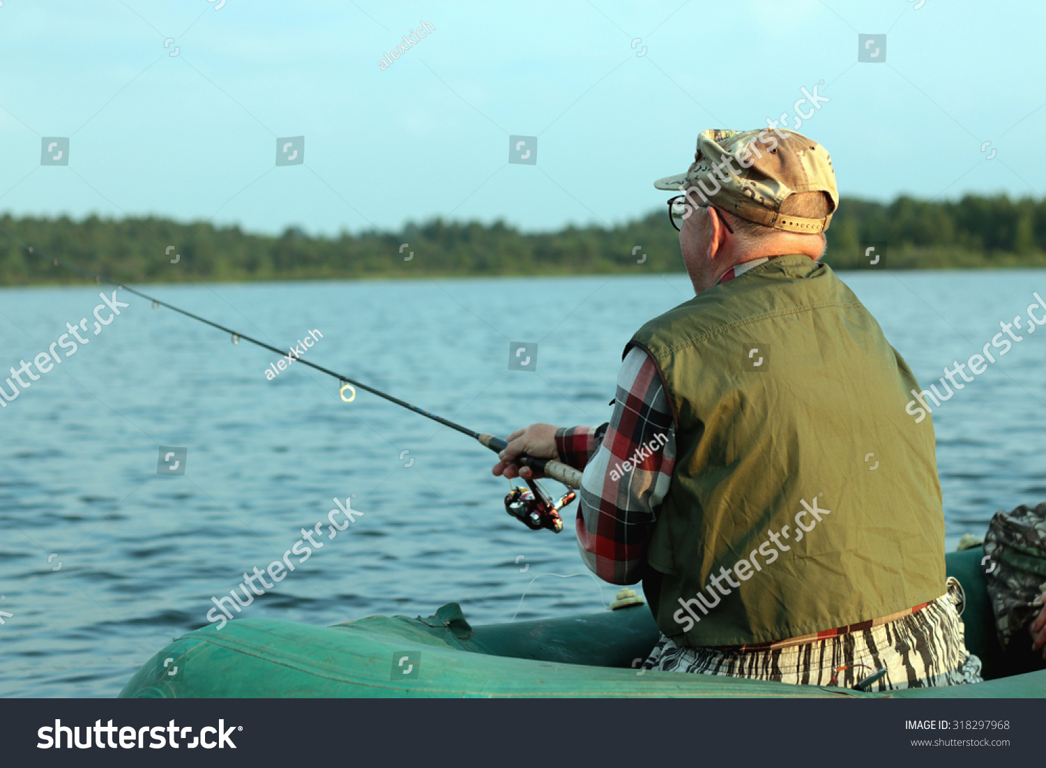 Spinning fisherman on a boat fishing #318297968