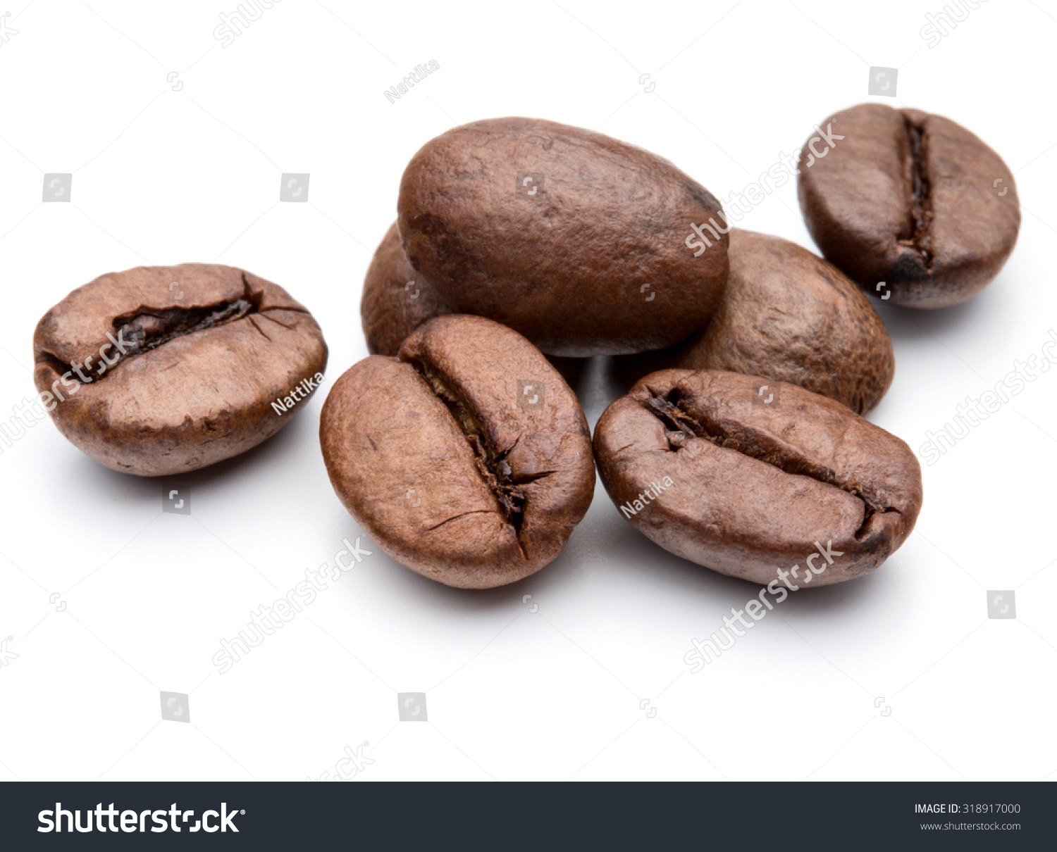 roasted coffee beans isolated in white background cutout #318917000