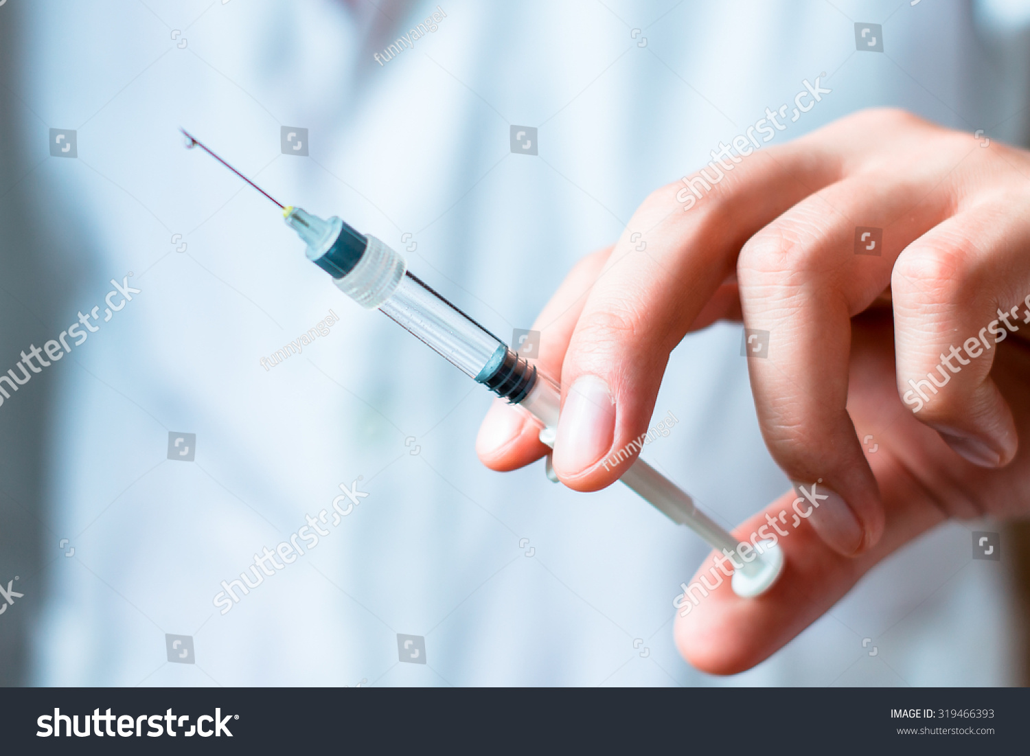 Syringe, medical injection in hand, palm or fingers. Medicine plastic vaccination equipment with needle. Nurse or doctor. Liquid drug or narcotic. Health care in hospital. #319466393