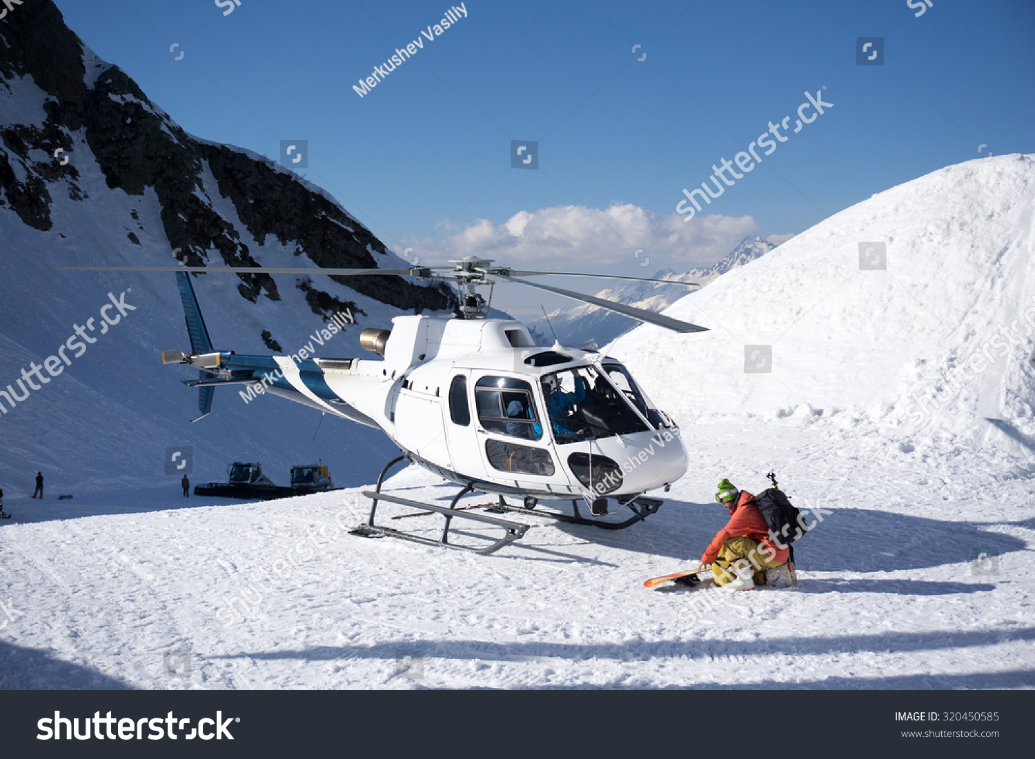White rescue helicopter parked in the snowy mountains #320450585