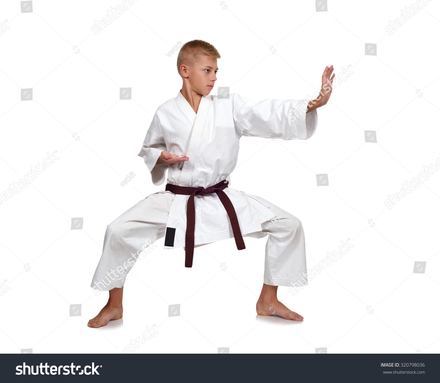 young karate boy isolated on white background #320798036