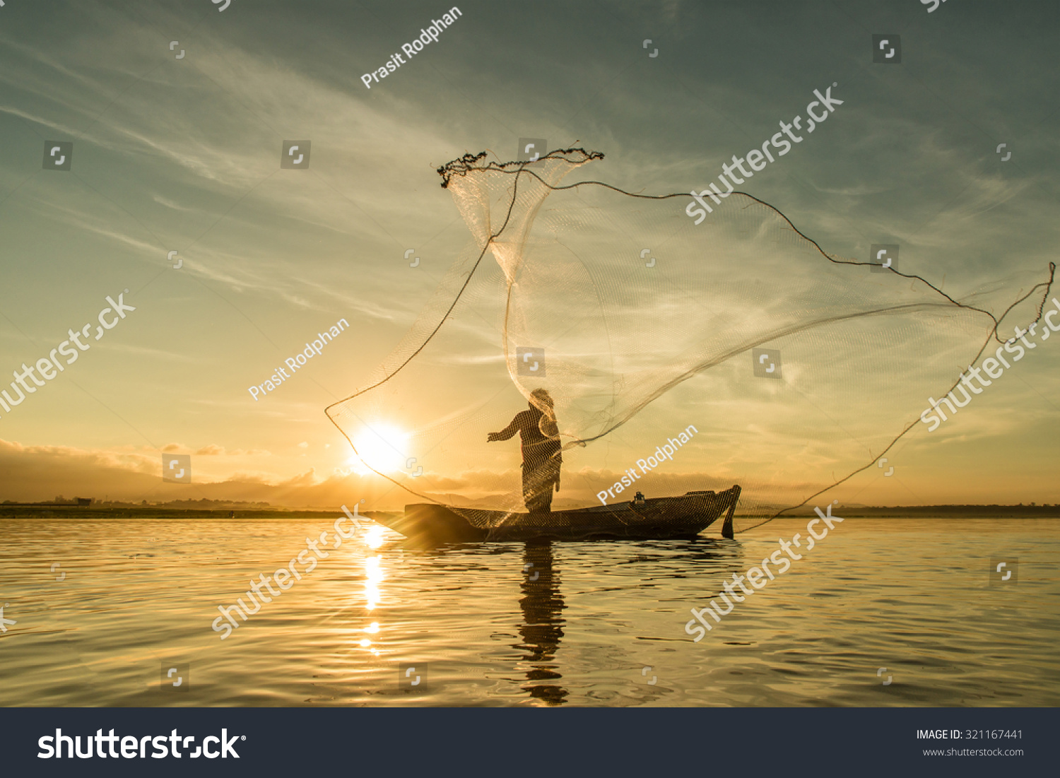 Fisherman fishing at lake in Morning, Thailand. #321167441