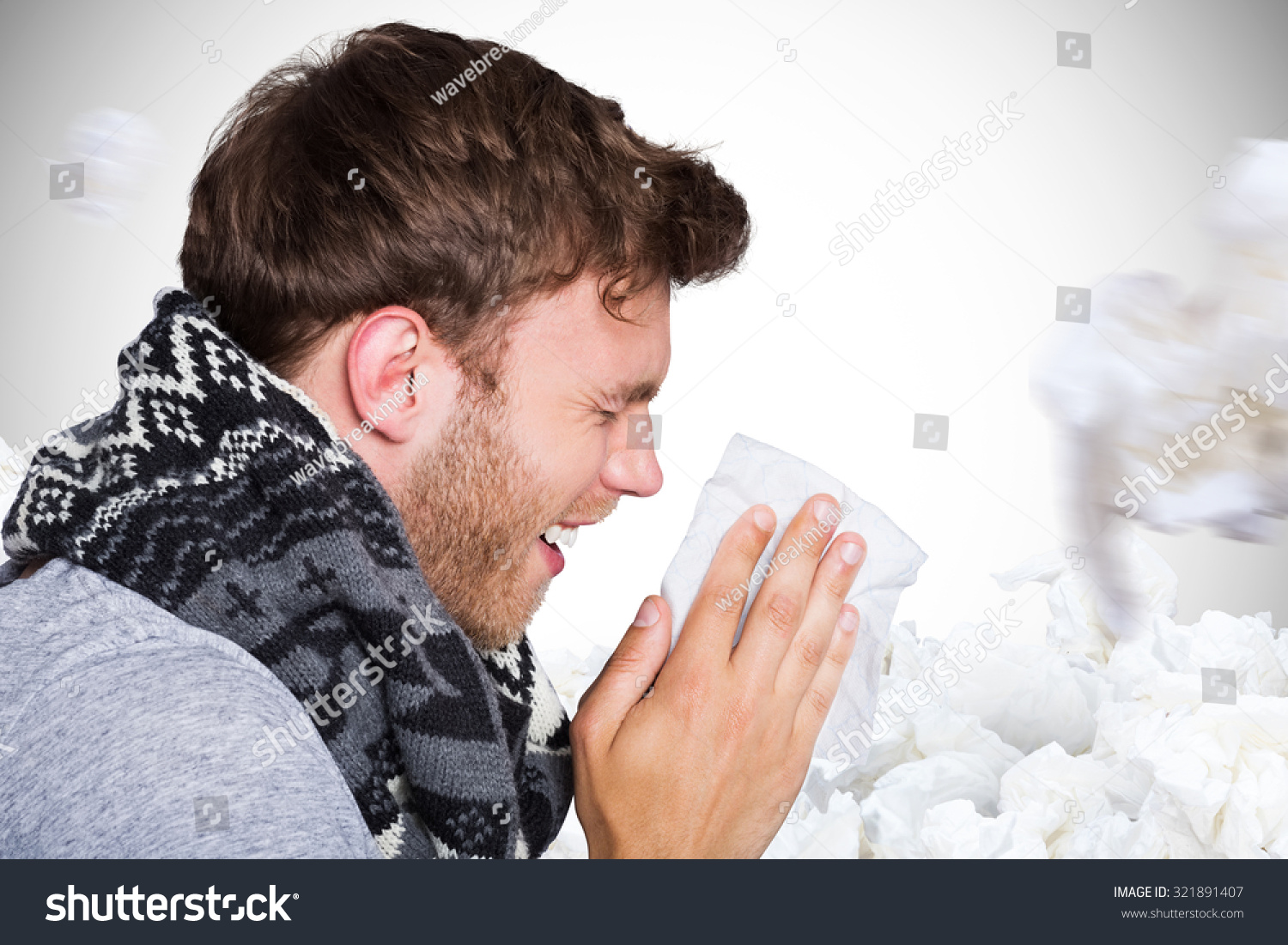 Close up side view of man blowing nose against white background with vignette #321891407