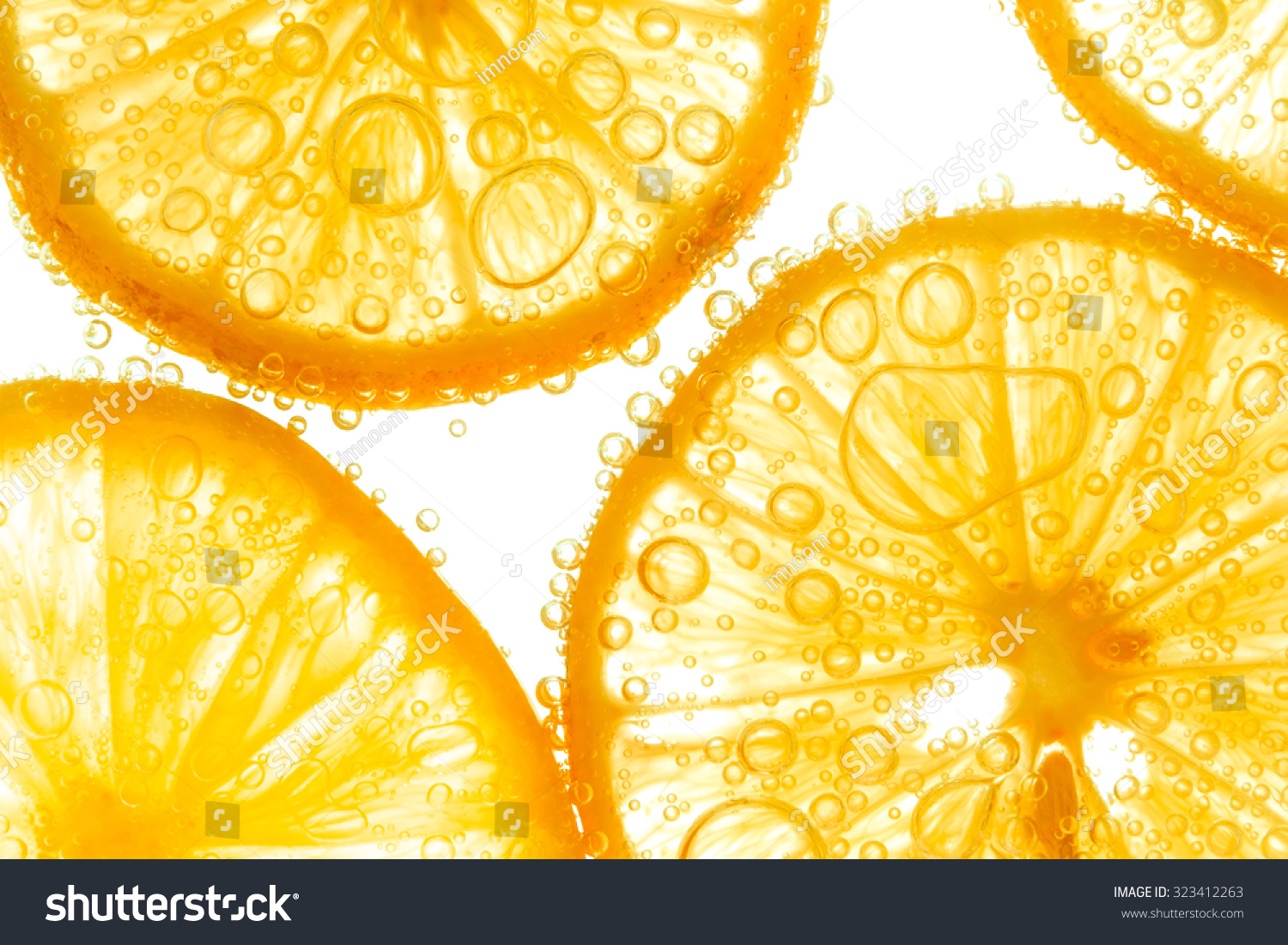 Fresh orange slice in water with bubbles on white background #323412263