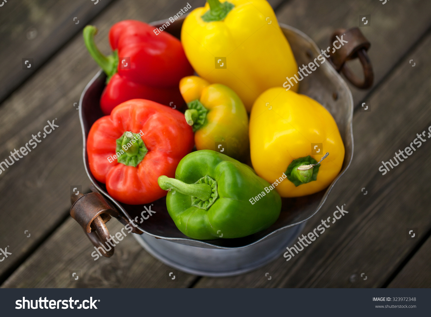 Fresh garden paprika in a rustic bowl #323972348